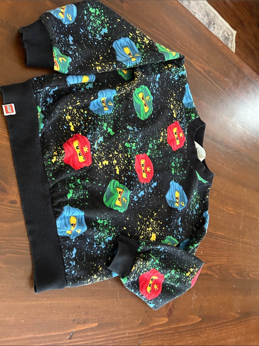 H&M Black Kids Sweatshirt with Red Green and Blue Character Faces